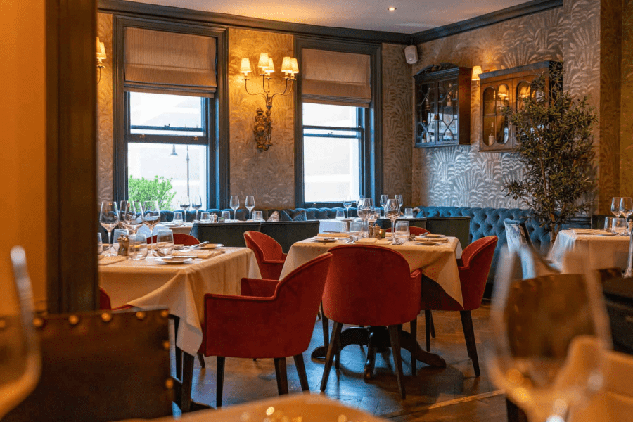 Set tables in Judys Dining Room at the Punch Bowl Pub