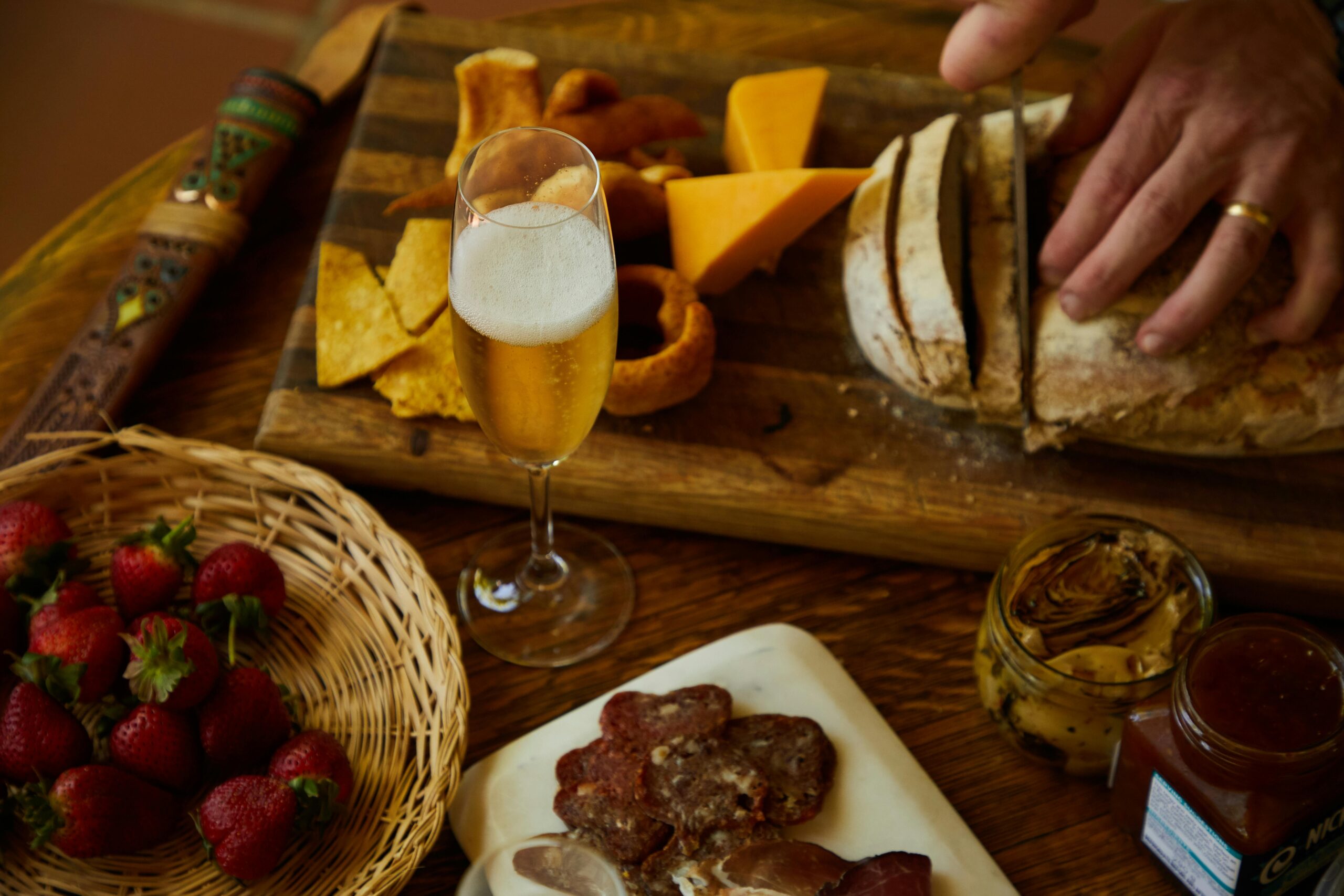 Wine tasting vouchers in London – a glass of sparkling wine with a sharing board