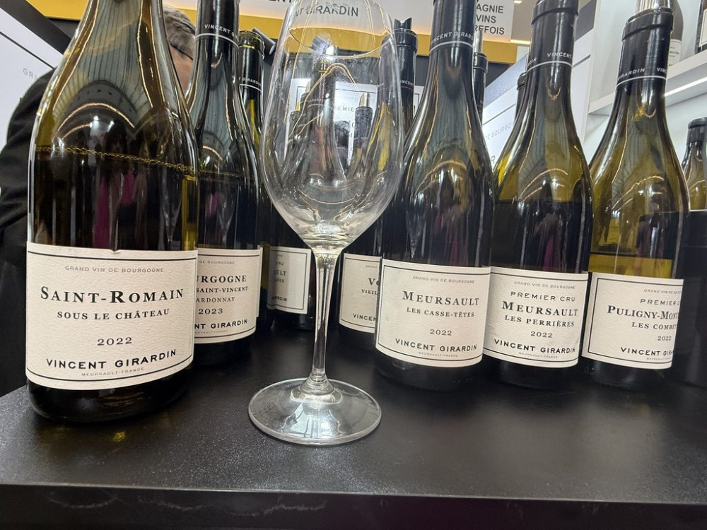 An empty wine glass in front of French white wine at a one day wine course london