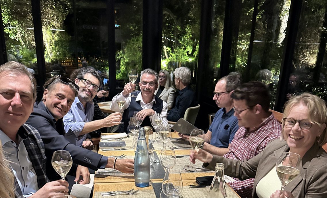 Guests raising their glasses at a London Wine Academy corporate wine dinner
